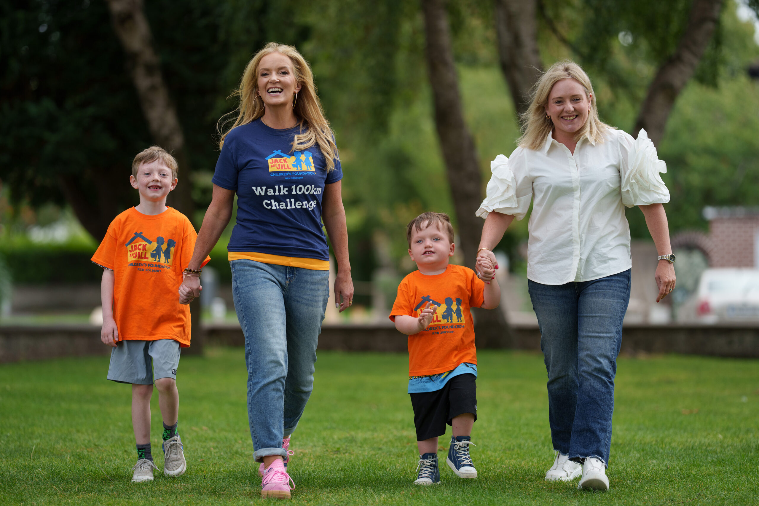 NO FEE PIC
PIC JULIEN BEHAL PHOTOGRAPHY 
Dr. Ciara Kelly steps up to joins forces with Life Pharmacy and the Jack and Jill Children’s Foundation to launch the “Walk 100km in September” campaign at Shannon’s Life Pharmacy, Rathfarnham. Pictured are Louise Garry and her sons Ross (aged 3) and Brady (aged 7);  and campaign ambassador Dr. Ciara Kelly. The nationwide fundraising campaign officially launches this month, with Life Pharmacy teams across the country leading the charge with the goal of raising €100,000 to fund 5,556 hours of in-home nursing care for families with children, up to the age of six, with severe learning disabilities often associated with complex medical needs.